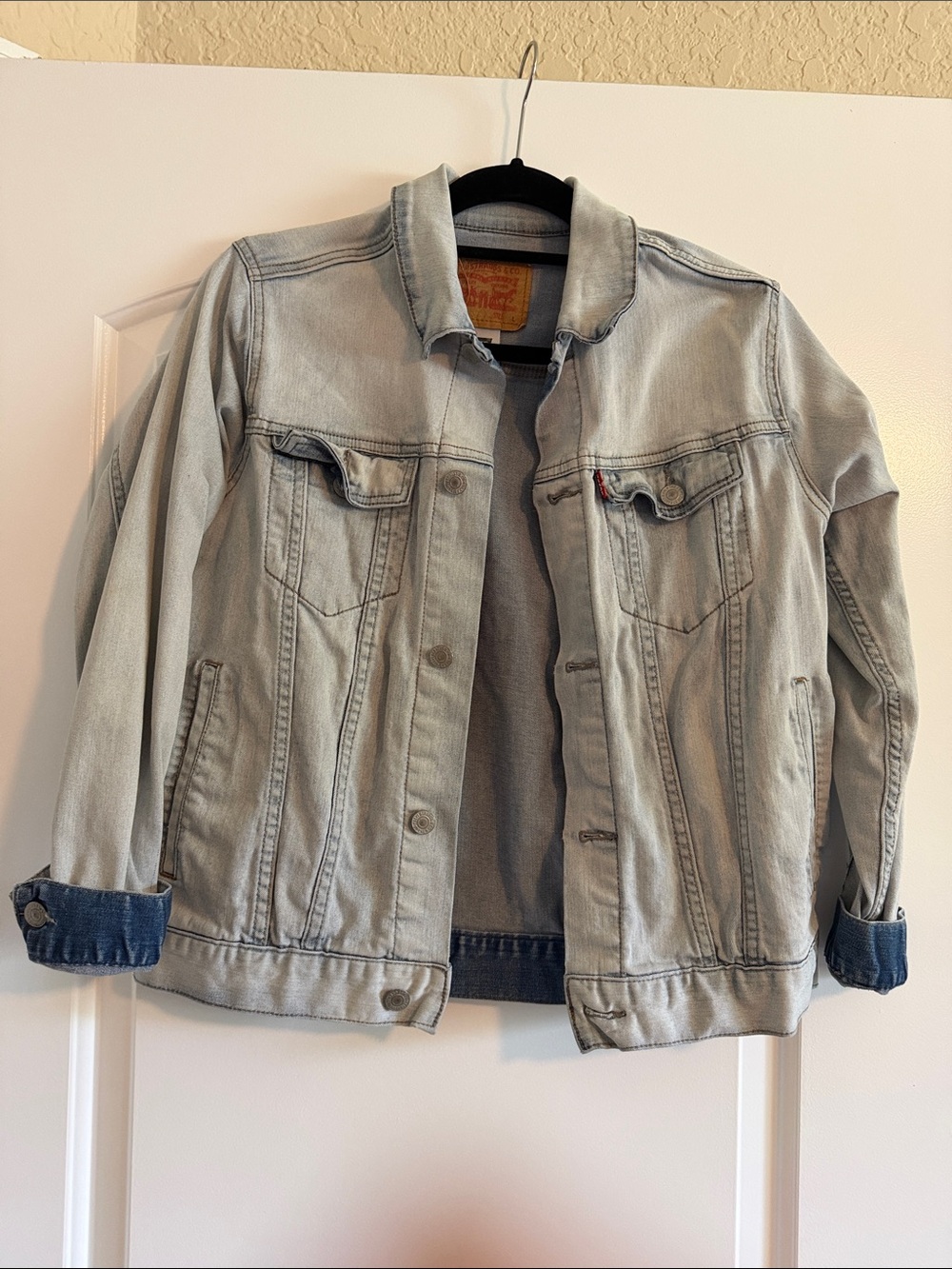 Levi's light blue denim jacket with tan leather patch